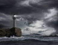 lighthouse-shining-over-stormy-ocean-john-m-lund-photography-inc.jpg