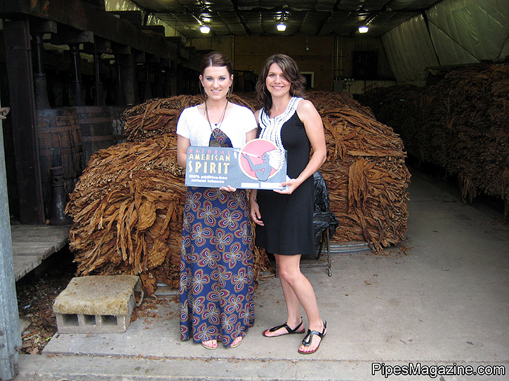 American Spirit Reps, Rami Bourgeois & Kim Trahan at the L.A. Poche Factory. In the background are Perique Bales waiting to be destemmed and processed for aging and fermenting.