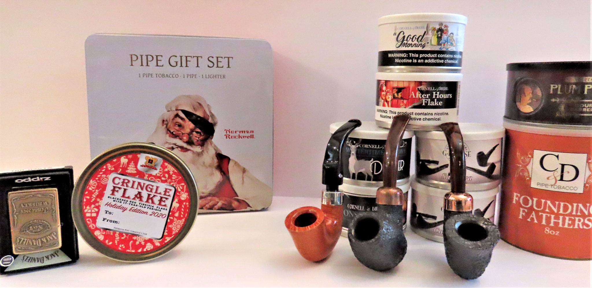 A Christmas montage of new pipes, tobacco tins and a new pipe lighter set to go out as gifts and, ahem, also to the Pundit.