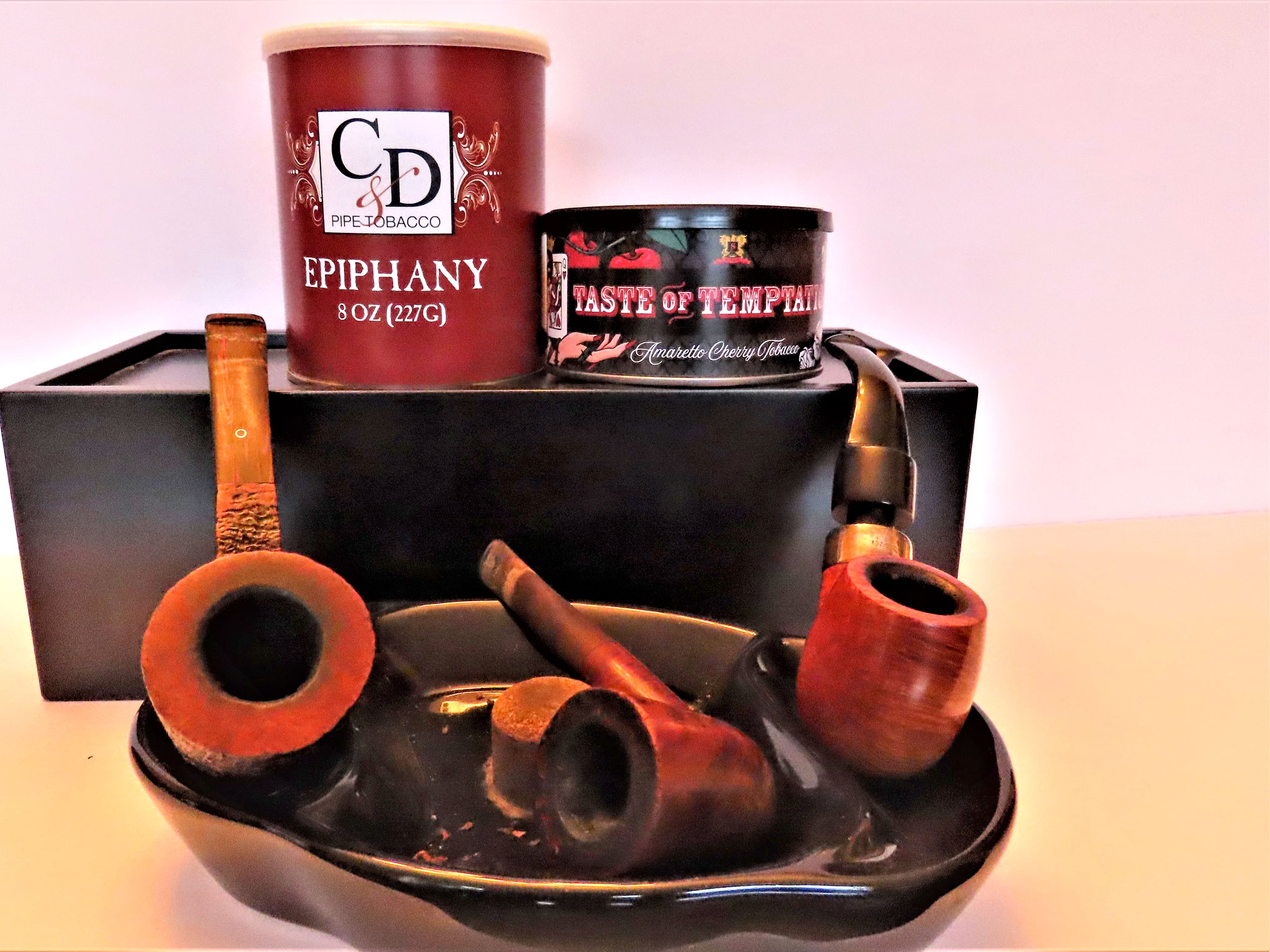 Some old friends take center stage at beginning of a new year of pipes and tobacco. From left, an ancient Ashton Brindle, an English made Royal Fallings basket pipe from the 1960s and a Deluxe Peterson System 9S, one of the large bent billiards in the Deluxe System chart. (Photo by Fred Brown)