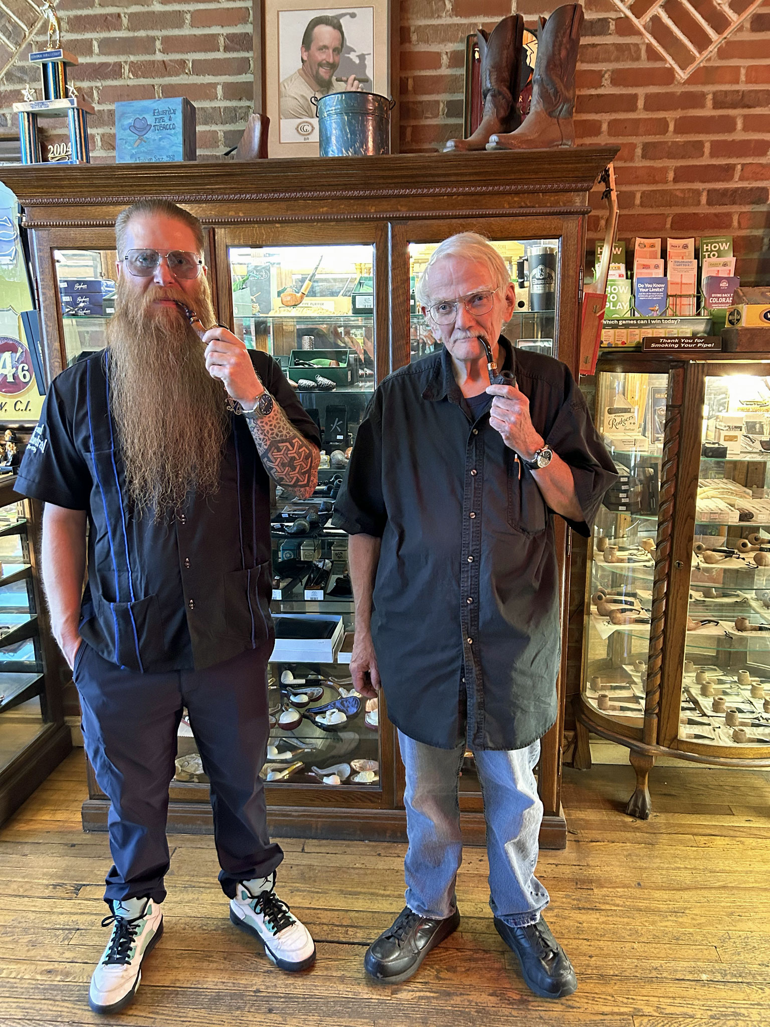 Doc Thomas and veteran tobacco blender Tom Young, who began working at the store when it opened in 1963, some 60 years ago. (Photo: Fred Brown)