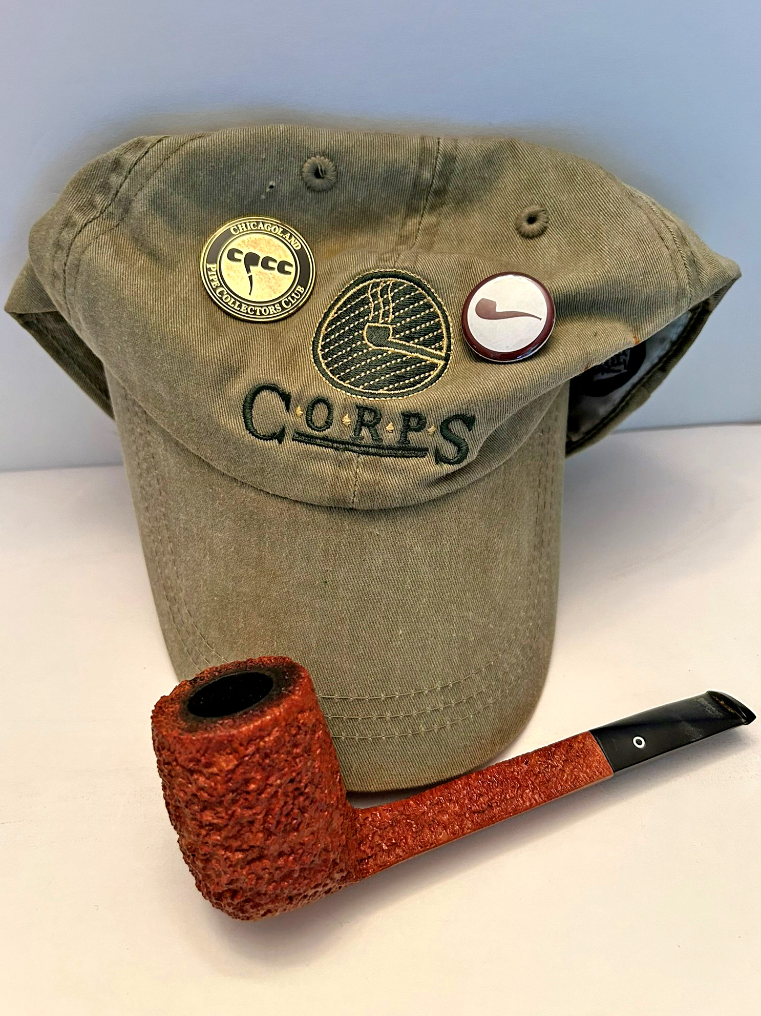 CORPS hat, a Northern Briars Pipe from marvelous pipe carver Ian Walker, and a couple of hat badges just to show off a bit. (Photo: Fred Brown)